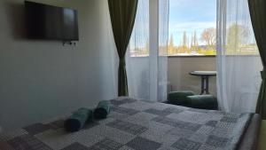 Apartamentai su baseinu