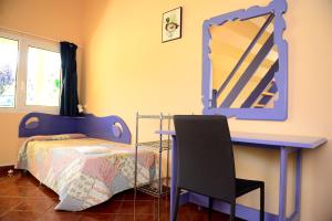 Quadruple Room with Garden View room in Albergue Finca El Mazo