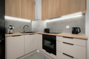 Nowoczesny Apartament z Tarasem i Parkingiem by Noclegi Renters