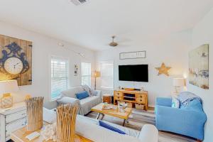 3-story home with heated outdoor pool BBQ area balconies partial ocean views