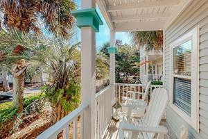 3-story home with heated outdoor pool BBQ area balconies partial ocean views