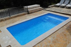 Seaside apartments with a swimming pool Supetar, Brac - 11360