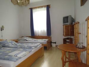 Quadruple Room room in Rézkakas Fogadó