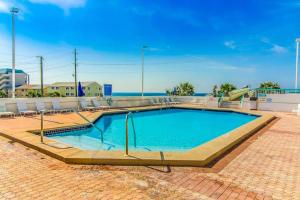 Gorgeous beach home with pool hot tub W&D central AC & partial ocean views