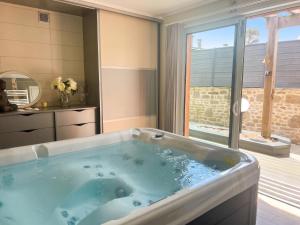 Appartement charmant à La Ferrière-aux-Étangs avec jacuzzi - 42 m²