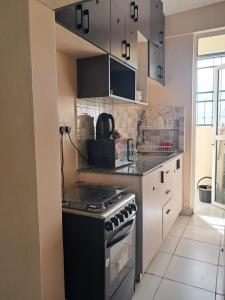 Cozy 2 BR with 3 Beds, AC & Hot Shower at Buxton Point Apartments Off RG Road Gate A