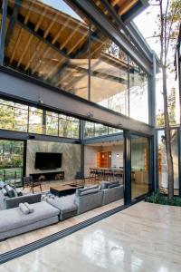 Architectural glass masterpiece villa in Avandaro Forest