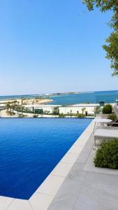 Luxury Sea view 2BR - Infinity Pool -Beach - Lusail