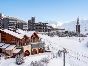 Appartement charmant à Les Menuires, 36 m², vue montagne.