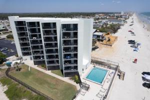 Beachfront with a pool at Ocean Trillium Condo ~ 101