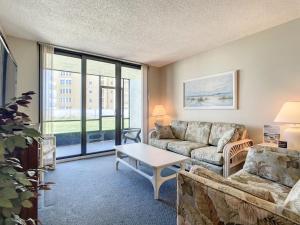 Beachfront with a pool at Ocean Trillium Condo ~ 101