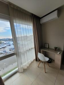 Apart Departamento con balcon al rio en condominio de la bahia de Nordelta loft wyndham