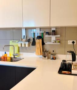 The Signature Suites at Cinnamon life Apartment