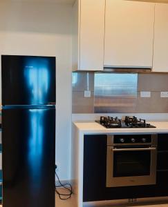 The Signature Suites at Cinnamon life Apartment