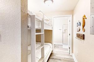 Discover Panama City Beach from this cozy condo with shared pools and fitness center