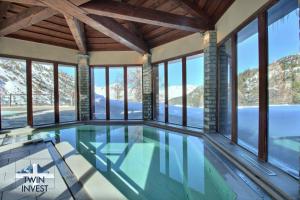 Arc 1950, Appartement 4 chambres, 8 pers, Vue Montagne, Sauna, Hammam, Jacuzzi, salle de fitness, Piscine extérieure chauffée