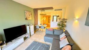 Luxury apartment with terrace and pool views on golf resort