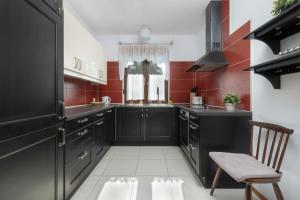 Amber House with a Garden and Terrace in Rusinowo by Noclegi Renters