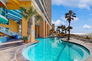 Beachfront high-end condo with Pool Hot tub & Splash pad