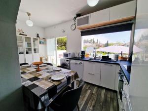 Urogallos Poolside Retreat 2BR, 2 Baths & Shared Pool