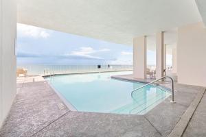 Inviting Gulf-front condo In Perdido Key with waterfront pool hot tub and oceanfront balcony
