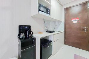 Nice and Elegant Studio near Campus at Pacific Garden Alam Sutera Apartment By Travelio