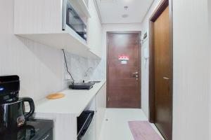 Nice and Elegant Studio near Campus at Pacific Garden Alam Sutera Apartment By Travelio