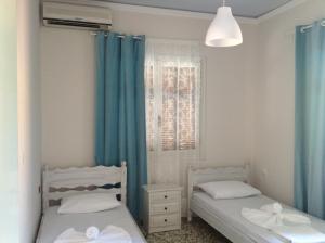 Two-Bedroom Apartment (4 adults) with Balcony room in Villa Chrisanthi