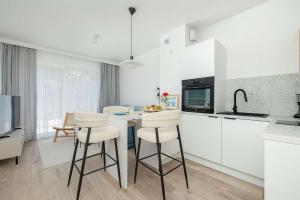 Sunny Apartment with a Balcony & Parking Near the Beach in Międzywodzie by Noclegi Renters