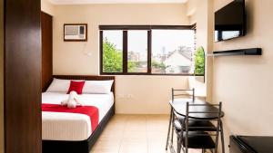 RedDoorz at Mola Suites near Shopwise Makati City