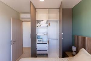 One-Bedroom with Balcony Near Malls Pool and City Views