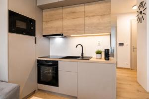 ALURE RESIDENCES 5 & 24h self check-in, private parking in front of the apartment building included, new building, the apartment building has its own park with a lake and outdoor fitness, childrens playground, CITY CENTER