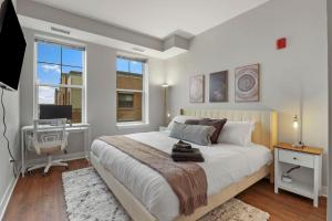 Downtown Elmhurst Luxury Apartments Near Metra & OHare with Pool, Gym, Parking & Theater