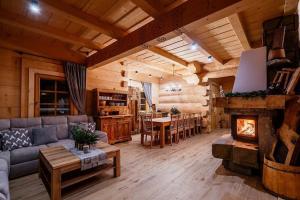 A large mountain-style house with a spa area