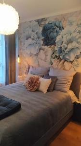 Apartamenty Centrum Warszawska 66 niebieski i różowy