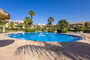 Luxury Apartment with Garden, Pool, and Golf Course