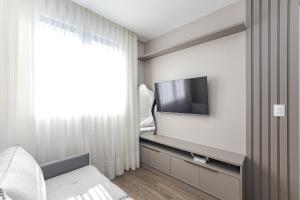 Apartamento 704 - Zion · Apto no centro p4 | Wi-Fi, Academia & Coworking