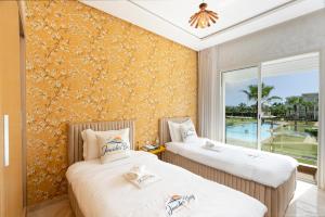 Appartement moderne 2 chambres à louer dans une résidence balnéaire CASABAY à Sidi Rahal - 4 piscines, vue piscine et accès direct à la plage