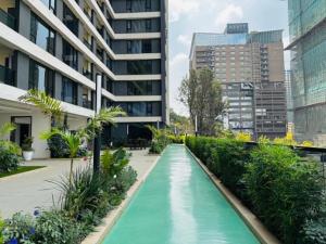 Misty Springs 1BR Apartment with a Pool, Gym & Kids Play Area