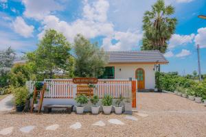 Three Neem Trees House