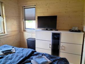 Ferienhaus Baltica 55qm bis 6 Gäste mit Sauna, Whirlpool, gemütlicher Terrasse, eingezäuntem Garten & bis zu 6 Hunde kostenlos