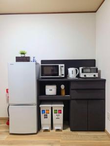Yuraku USJ 5 minutes Nishikujo Station 5 minutes on foot Entire house for exclusive use Two toilets Maximum 7 people Direct access to Umeda, Osaka in 4 minutes Direct access to Kansai Airport
