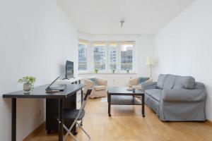 Spacious Apartment with a Balcony and Workspace Close to Downtown by Noclegi Renters