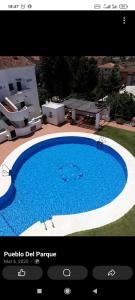 Pool-View Apartment with Terrace & Lift in Pueblo del Parque