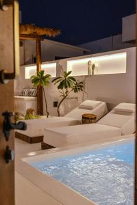 Sea Whisper Suites with private Cycladic patio and heated pool - sea side