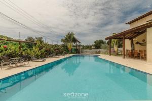 Casa em Cond. c piscina prox. da Praia ATP0006