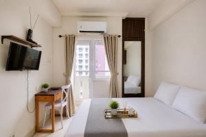 Comfy Studio Apartment @ Green Pramuka City By Travelio