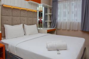 Comfortable 1BR at Signature Park Grande near Cawang Station Apartment By Travelio