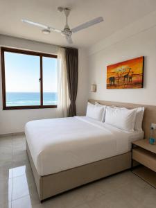 Sandy Shore Beach Apartments - Karibu Quarters