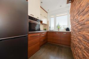 Practical Family Apartment with 2 Bedrooms a Few Minutes From the Airport by Noclegi Renters